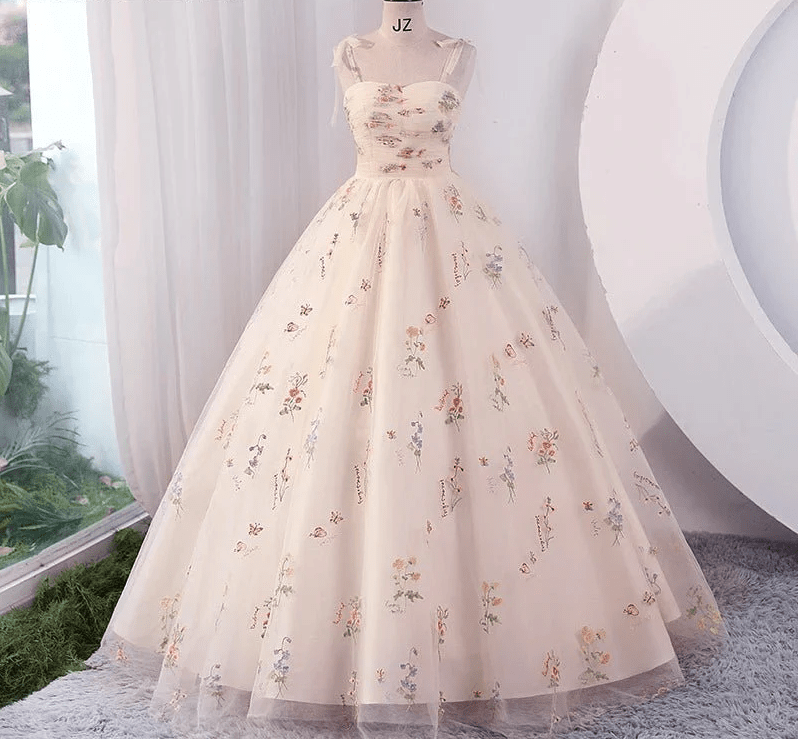 Floral dress on a mannequin against a neutral background