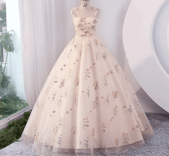 Floral dress on a mannequin against a neutral background