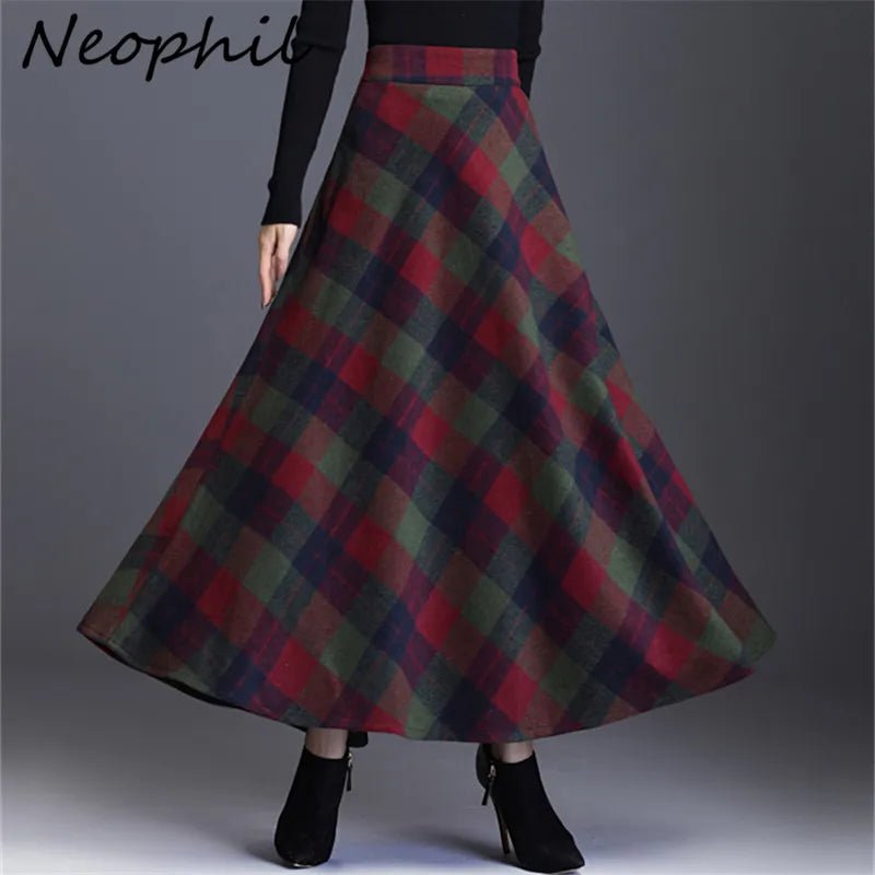 A midi-length plaid skirt with a green, red, and black color scheme, featuring pockets and a pleated A-line design.