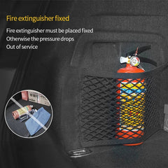Fire extinguisher in a car's net pocket with text about proper placement.