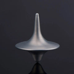 A silver-colored metal spinning top