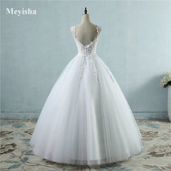 White wedding dress on a mannequin against a light blue wall with 'Meyisha' branding.