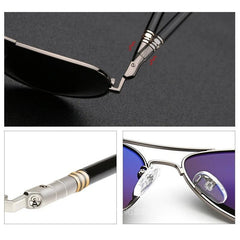Sunglasses with black and silver frame on a dark background