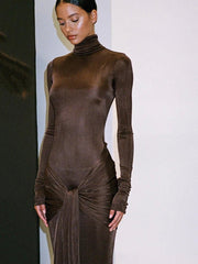 Woman wearing a brown bodysuit with a white background