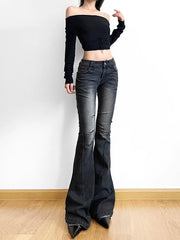 Person wearing black off-shoulder top and flared jeans on a white background