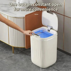White trash bin with open lid in a bathroom setting, text 'One button constant open for more convenience'.