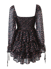 Black floral dress with sheer long sleeves on a white background