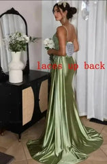 Woman in a green satin evening gown with 'laces up back' text overlay.