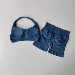 Blue bikini set on a light gray background