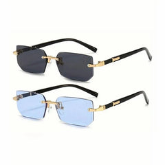 Two pairs of sunglasses with black and gold frames on a white background