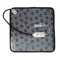 Gray heating pad with black paw prints and USB cable on a white background
