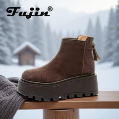 Brown platform boot with visible Fujin branding against a snowy background