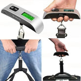 Digital luggage scale being used by a person, held by a hand, and shown with a strap attached.