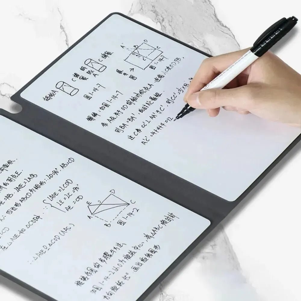 Hand holding a pen over a transparent writing pad with mathematical equations and diagrams.