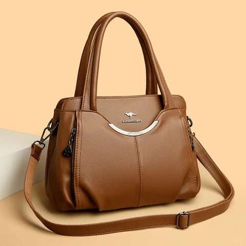 Brown handbag with a visible brand logo on a beige background