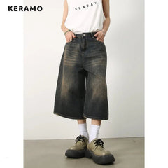 Person wearing black wide-leg jeans and white sneakers on a plain background with 'KERAMO' branding.