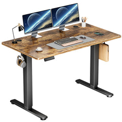 Wooden desk with computer setup on a white background