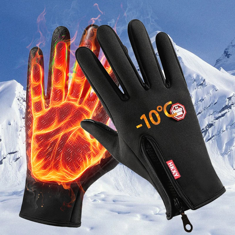 Black heated gloves with digital display against a snowy mountain background