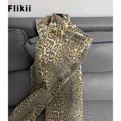 Leopard print pants on a gray sofa with 'Flikii' branding.