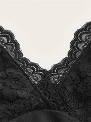 Black lace trim on a garment against a white background