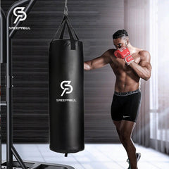 Man in boxing stance with a punching bag branded 'Saeepabul' in a gym setting.