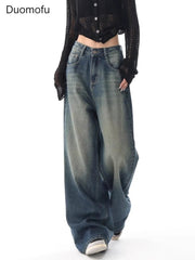 Person wearing wide-leg jeans with a plain background and 'Duomofu' branding.