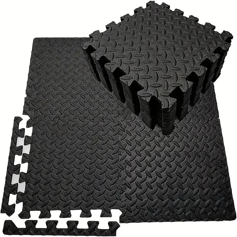 Black foam floor mats on a white background