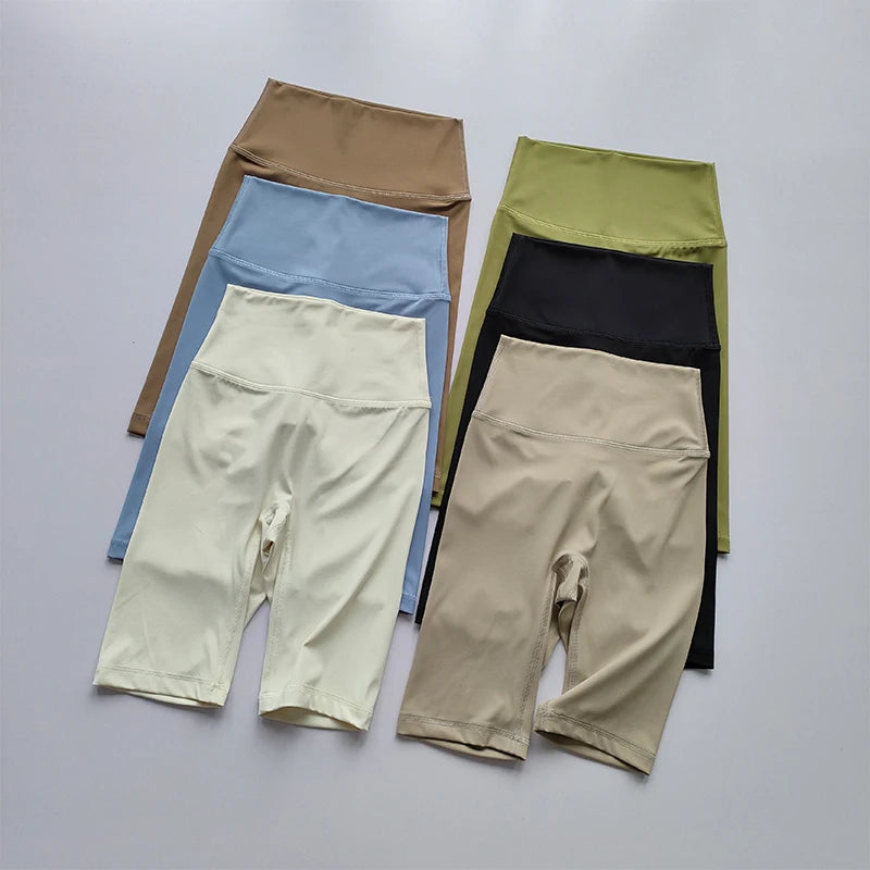 Set of colorful leggings on a light gray background