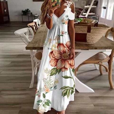 Woman wearing a white floral dress in a dining room setting