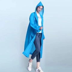 Person wearing a blue hooded raincoat on a light gray background