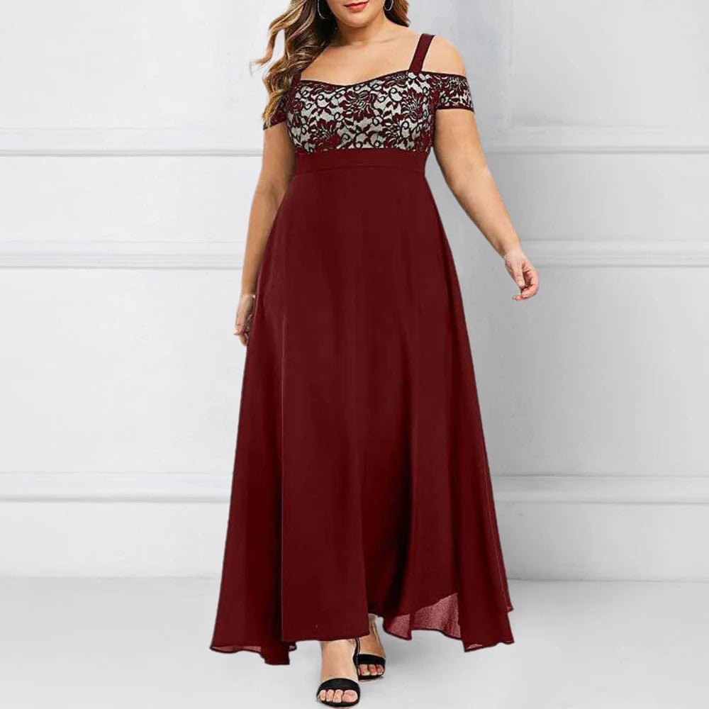 Woman wearing a burgundy dress with lace detailing on a white background
