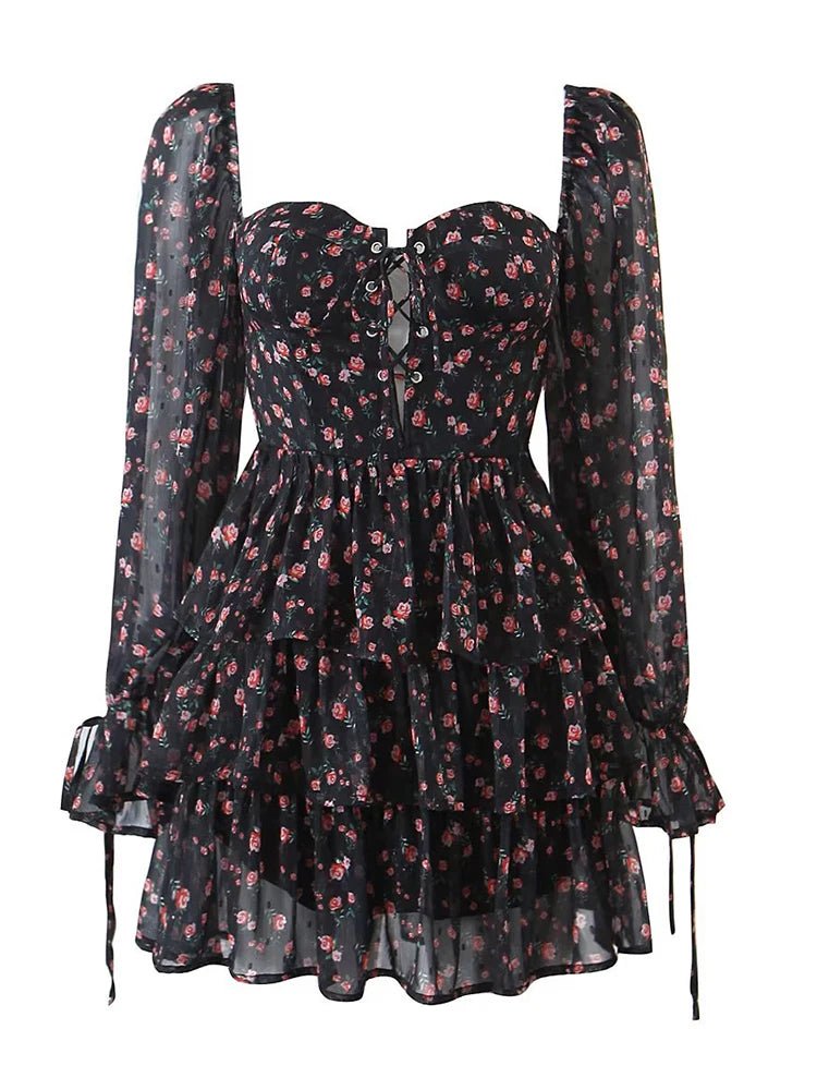 Black floral dress with sheer long sleeves on a white background