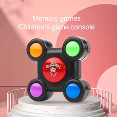 Children's game console with colored buttons on a pink background