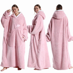 Pink hooded blanket worn by a model on a white background