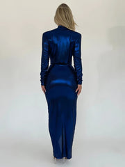 Woman wearing a blue satin dress against a white background