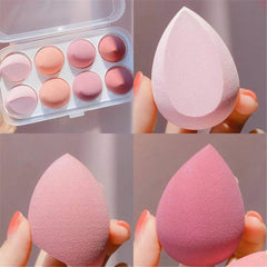 Set of pink makeup sponges and color swatches in a case.