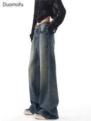 Person wearing wide-leg jeans with a black jacket on a white background, featuring the brand 'Duomofu'.