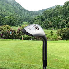 Golf club on a golf course with greenery and mountains in the background
