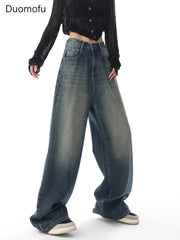 Person wearing wide-leg jeans with a plain background and 'Duomofu' branding.