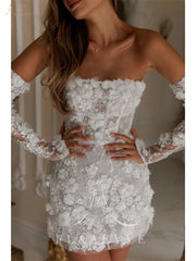 White lace dress with long sleeves worn by a model indoors.