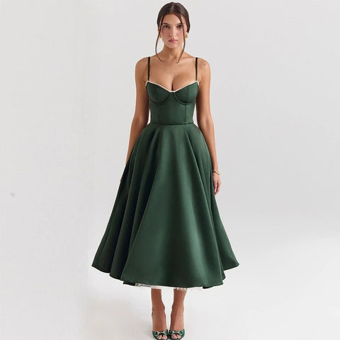 Woman wearing a green dress on a white background