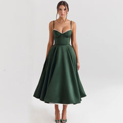Woman wearing a green dress on a white background
