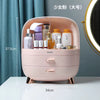 Pink cosmetic organizer with skincare products on a white surface, with measurements indicated.