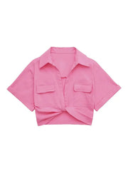 Pink cropped shirt with a knot detail on a white background