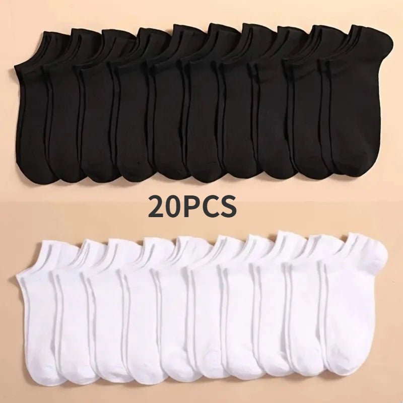 20 pairs of black and white ankle socks on a beige background