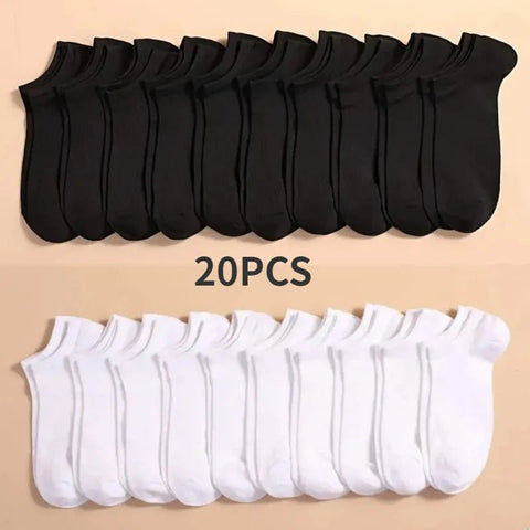 20 pairs of black and white ankle socks on a beige background