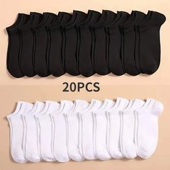 20 pairs of black and white ankle socks on a beige background