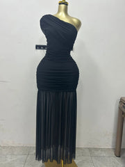 Navy one-shoulder dress on a mannequin against a white wall.