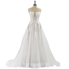 White lace wedding dress on a mannequin against a white background