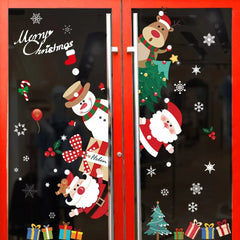 Decorative Christmas window stickers on a glass door with Santa Claus, snowman, and reindeer.
